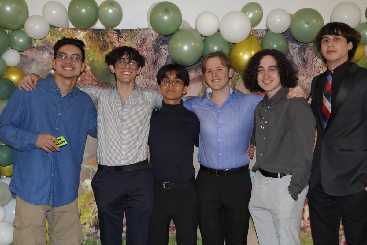 Seniors pose for a photo at Senior Night