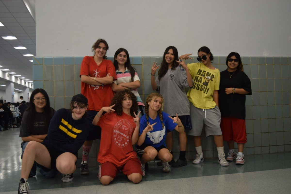 Students pose in Adam Sandler themed outfits.