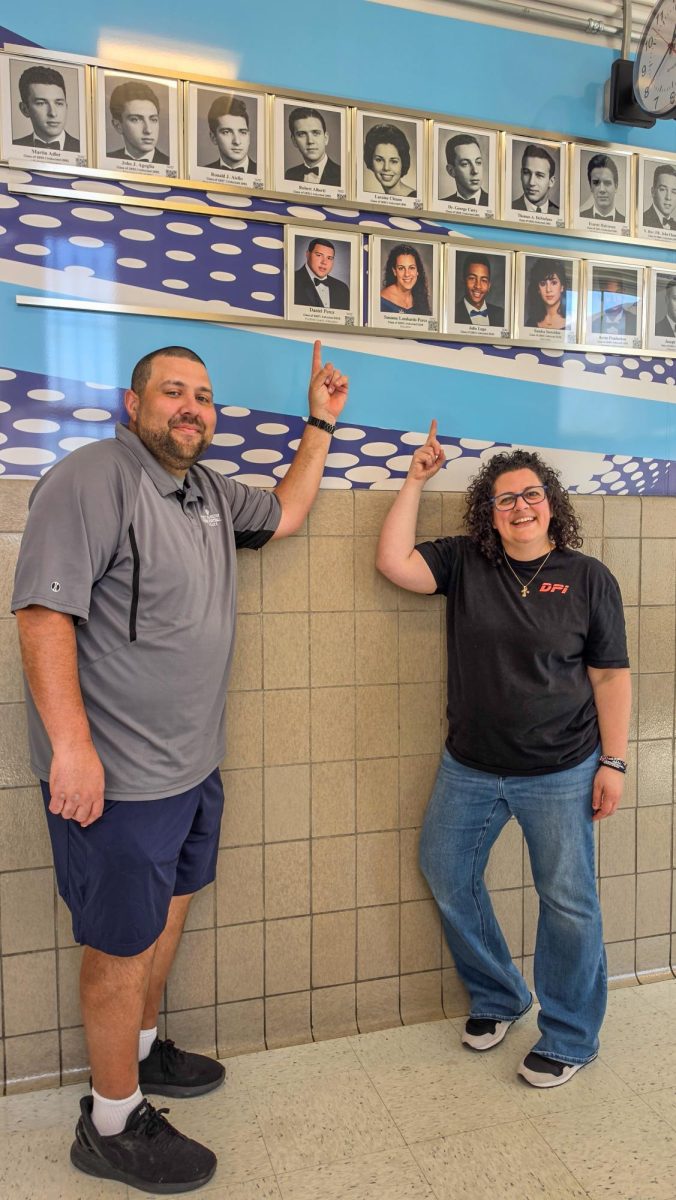 Mr. and Mrs. Perez pose with their Hall of Fame photos