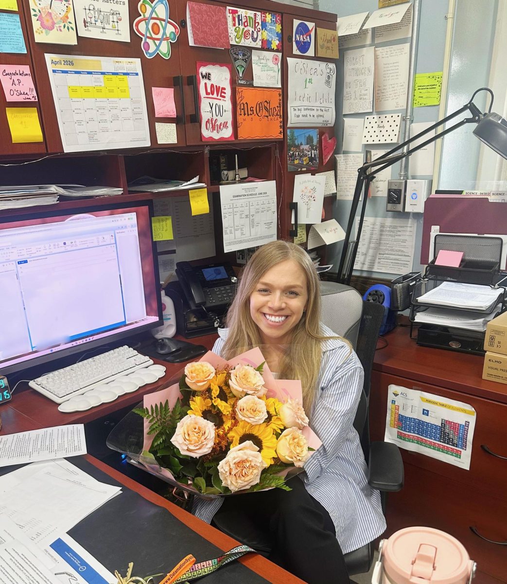 Ms. O'Shea receives flowers from teachers in the science department during AP Week.